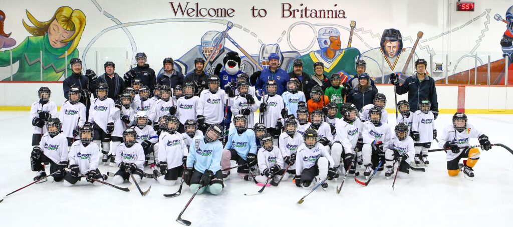 VANCOUVER, BC - NOVEMBER 6, 2019:  Vancouver Canucks Alumni Dave Babych and mascot Fin help teach young children to skate and play hockey as part of the First Shift initiative on November 6th, 2019 in Vancouver, British Columbia, Canada.  (Photo by Devin Manky)